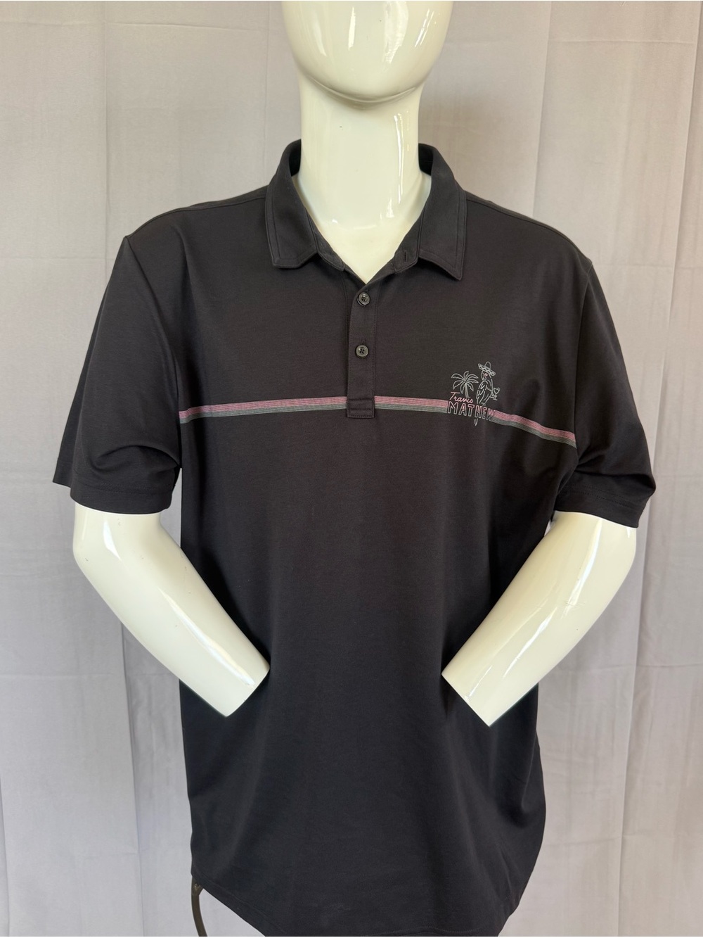 Travis Mathew Black Polo with Pink-Gray Chest Stripe